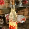 Lighted Wine Bottle With Swirling Glitter Hope Poinsettia Design With Cardinals Snow Globe 1 Lighted Wine Bottle With Swirling Glitter Hope Poinsettia Design With Cardinals Snow Globe -Decorative Candle Shop hope