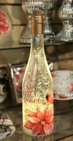 Lighted Wine Bottle With Swirling Glitter Peace Poinsettia Design With Cardinals Snow Globe