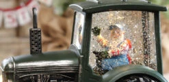 Lighted Green Tractor Water Lantern With Santa In Swirling Glitter 9 Lighted Green Tractor Water Lantern With Santa In Swirling Glitter -Decorative Candle Shop tractor close up